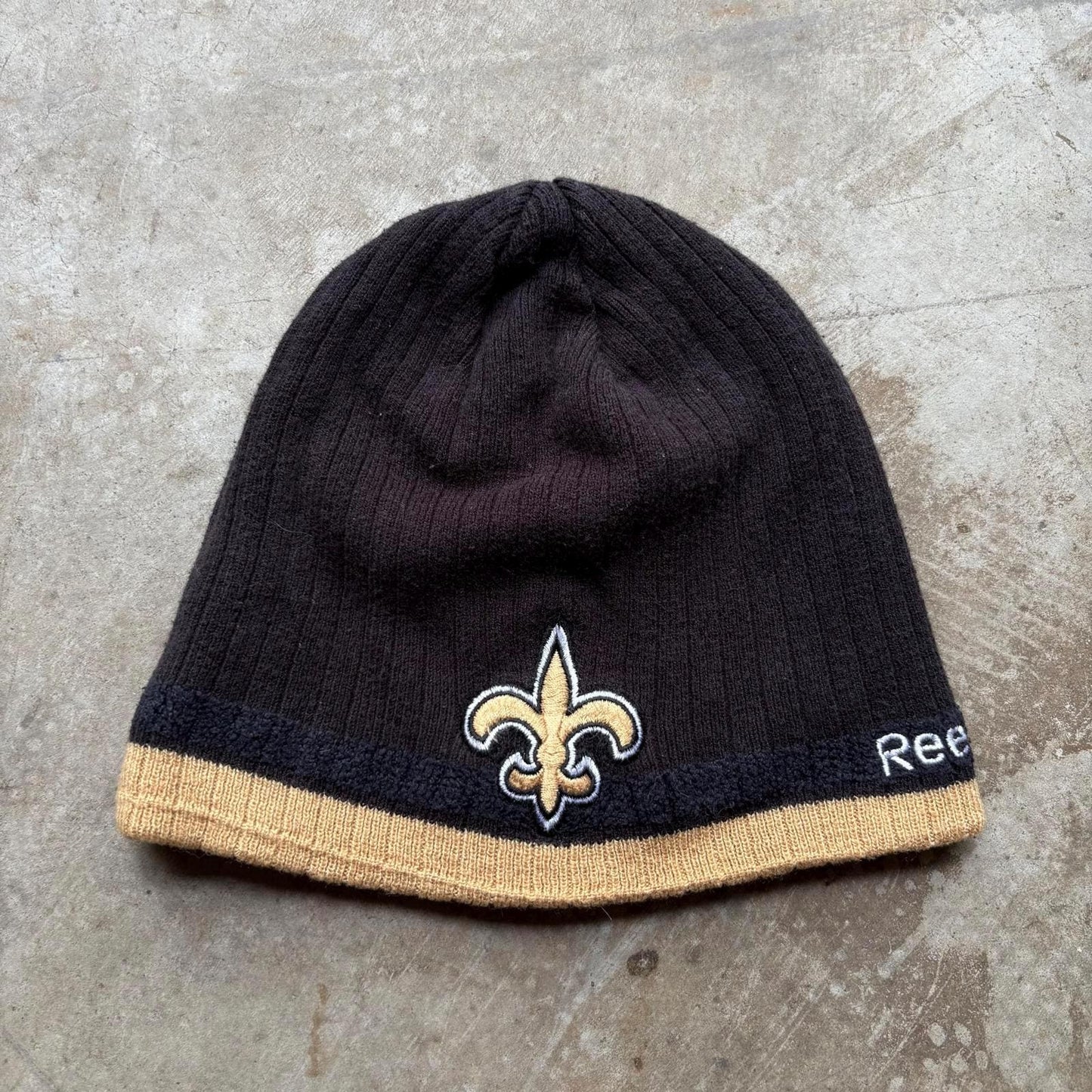 Vintage Y2K New Orleans Saints Reebok NFL Grunge Beanie Graphic Tee – Cozy Vibes · Trending Graphic Apparel