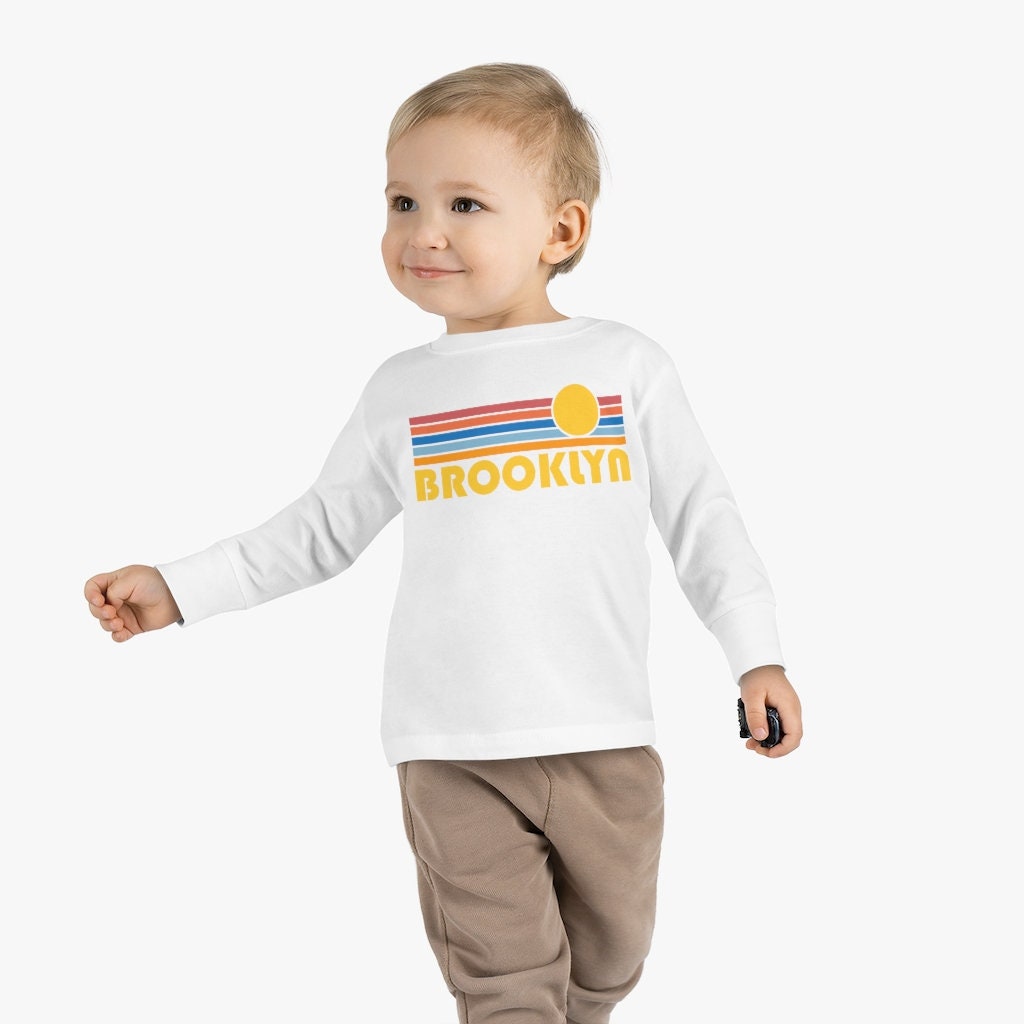 Brooklyn New York Toddler Long Sleeve Shirt Retro Sun Unisex Toddler Brooklyn T Shirt Personalization Available Graphic Tee – Warm & Stylish · Perfect For Daily Wear