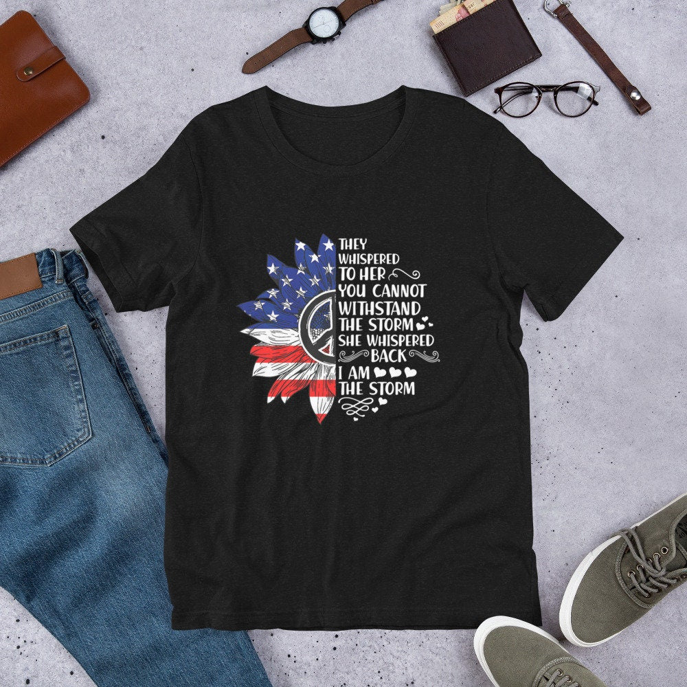 They Whispered To Her You Can39t Withstand The Storm She Whispered Back I Am The Storm Unisex t shirt Graphic Tee – Bold Style · Must-Have Style