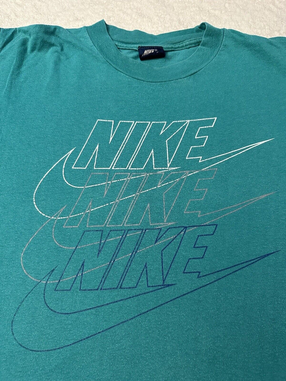 Vintage 1980s 80s Nike Triple Swoosh Brand Logo Graphic T Shirt Blue Tag M L Graphic Tee – Bold Style · Trending Graphic Apparel