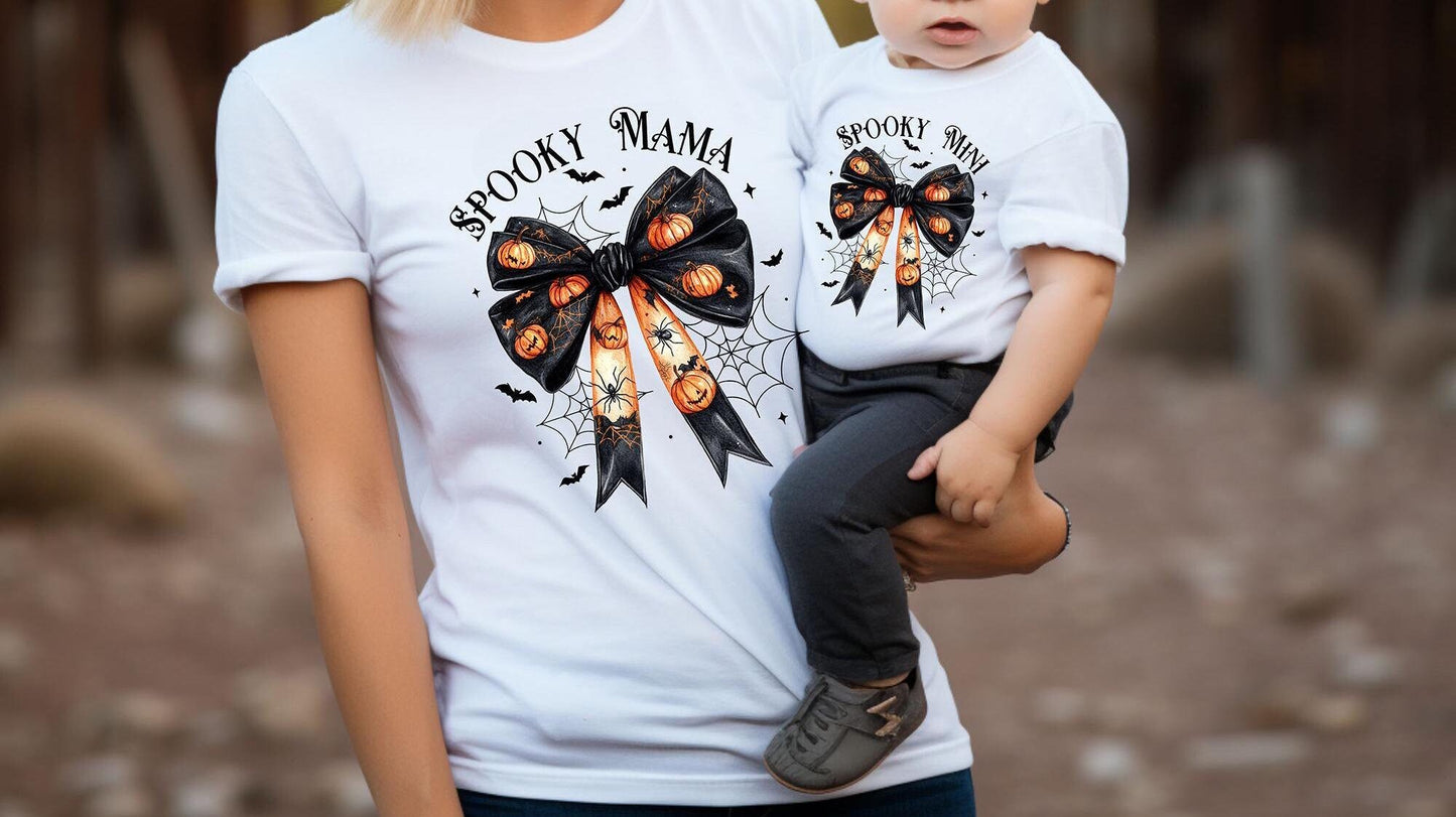 Spooky Mama and Mini Matching Halloween Shirts Cute Pumpkin and Spider Bow Design Tshirt Perfect for Moms and Daughters Halloween Outfit Graphic Tee – Bold Style · Top Pick For Any Outfit