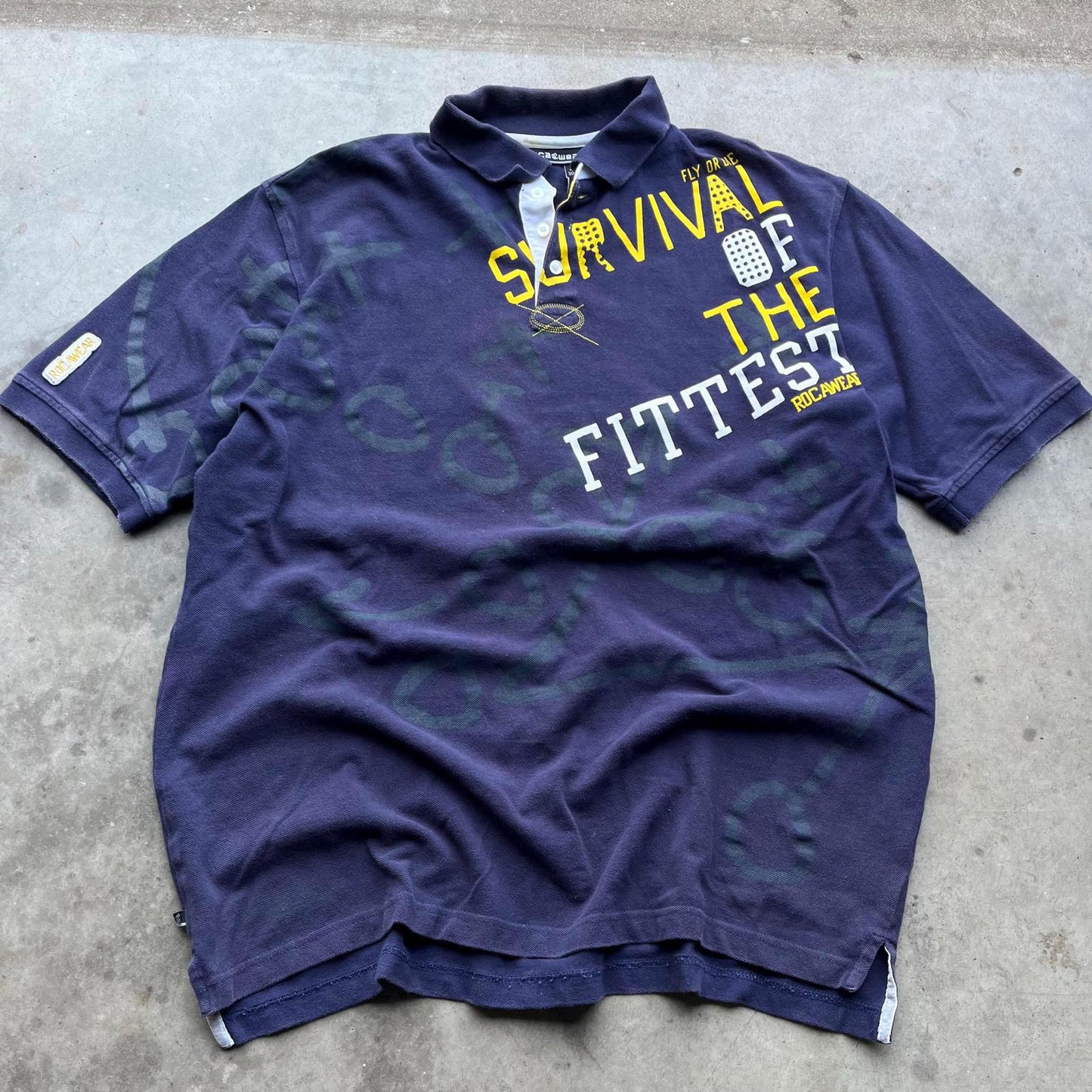 Vintage Y2K Rocawear Sportswear AOP Survival of Fittest Polo Graphic Tee – Feel-Good Design · Trending Graphic Apparel