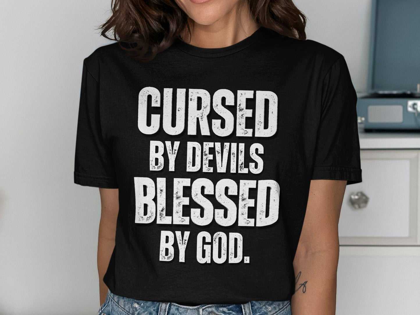 Cursed By Devils Blessed By God T shirt Inspirational Graphic Tee Motivational Quote Shirt Spiritual Statement Top Unique Gift Idea Graphic Tee – Fan Favorite · Perfect For Daily Wear
