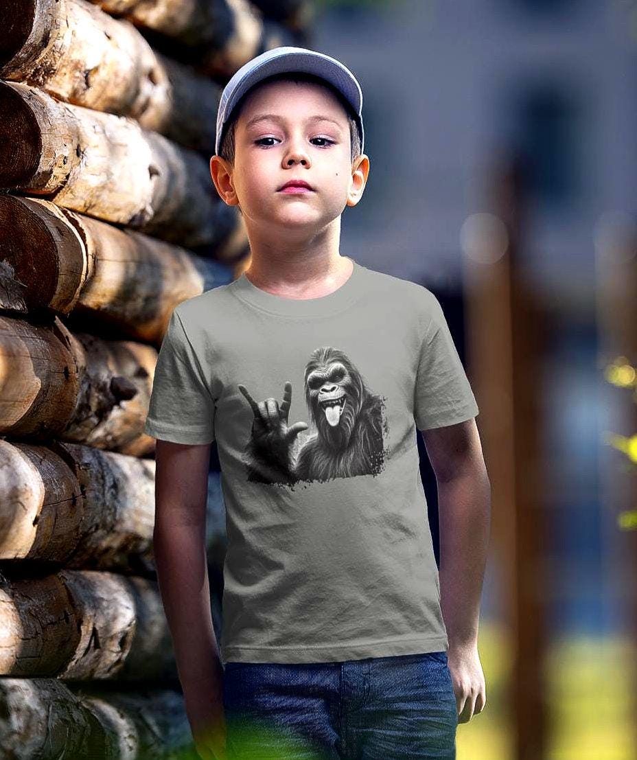 Youth Sasquatch Bigfoot Tee Kids Playful Shirt Gift for BoysGirls Outdoor Adventure Shirt BirthdayParty Apparel Unique Kids Clothing Graphic Tee – Cozy Vibes · Trending Graphic Apparel