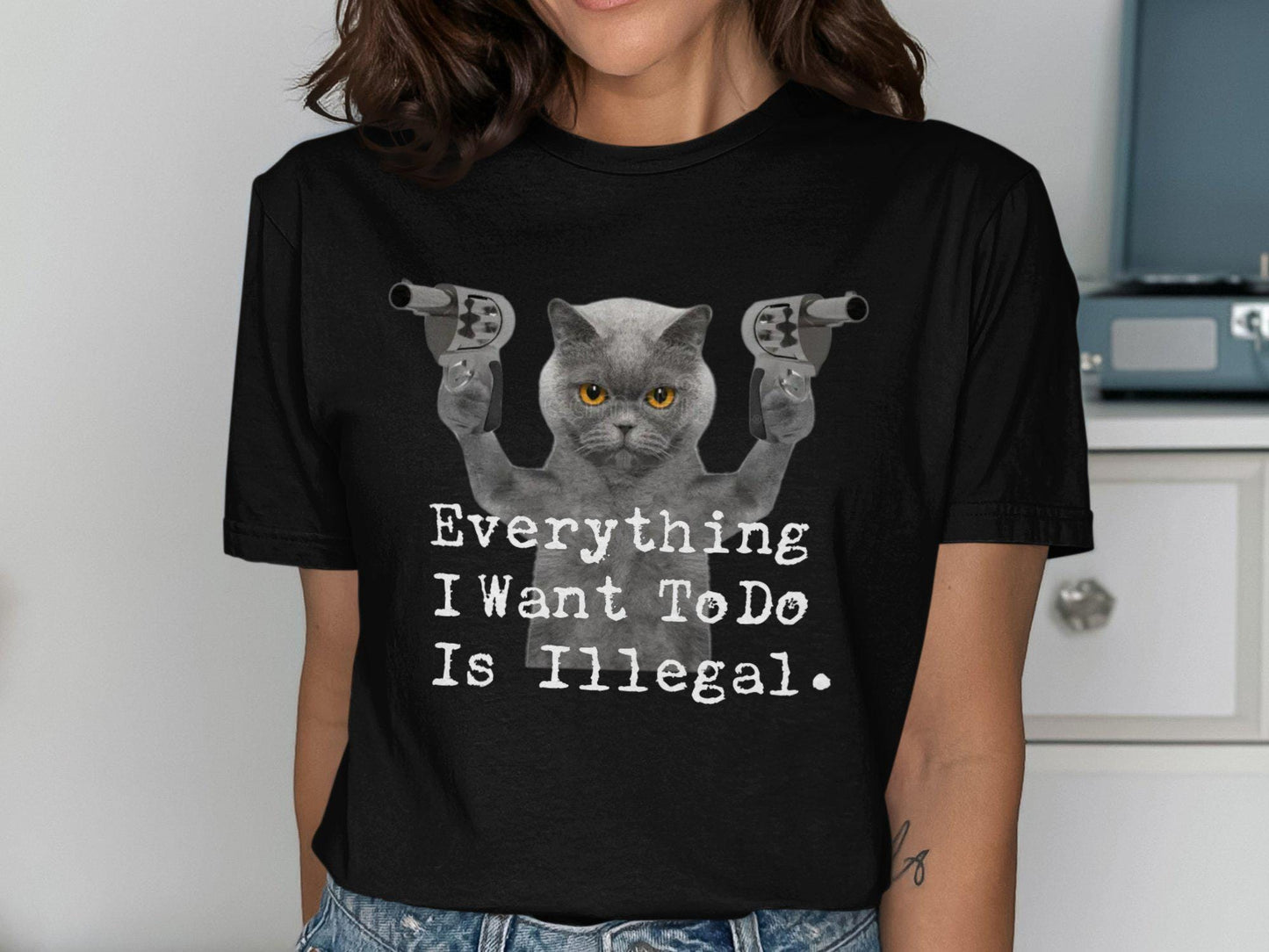 Funny Cat with Guns Graphic Tee Everything I Want To Do Is Illegal T Shirt Humorous Cat Lover Gift Cute Cat Meme Shirt Novelty Tee Graphic Tee – Aesthetic Look · Great Gift For Fans