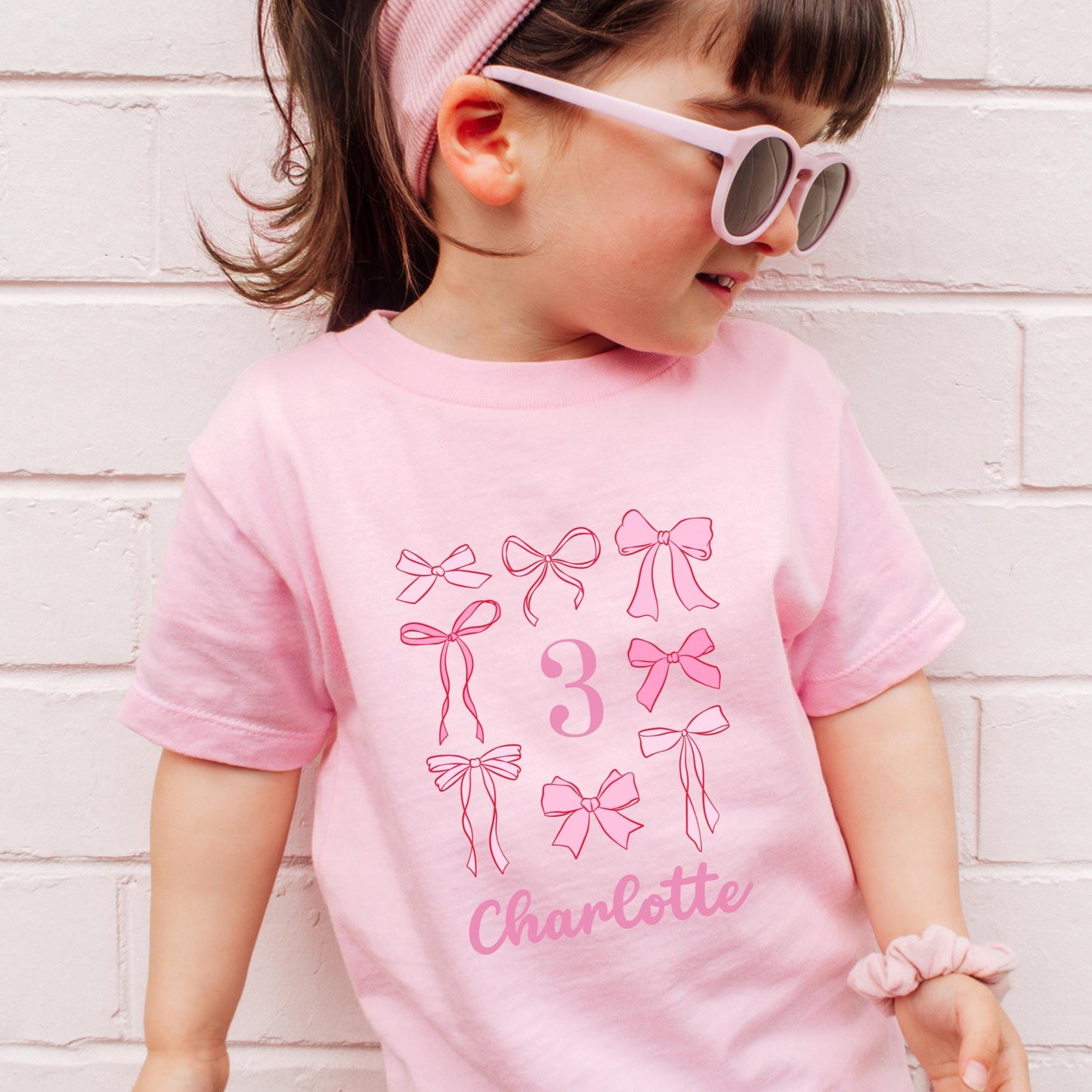 Bow Birthday Shirt Toddler Personalized Shirt Coquette Birthday T Shirt Girl Birthday Party TShirt Pink Bow Party Outfit Toddler Birthday Graphic Tee – Aesthetic Look · Trending Graphic Apparel