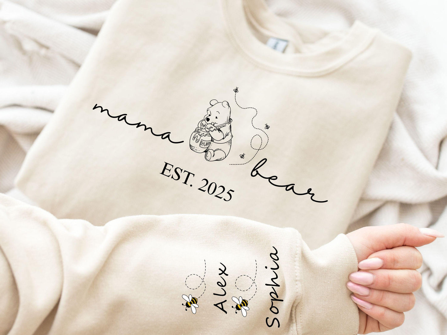 Custom Mama Bear Hoodie and Sweatshirt Mother Day Gift Winnie the Pooh Mothers Days Gift Mama Est with Kid Name on Sleeve Classic Shirt Hoodie – Premium Graphic · Trending Graphic Apparel